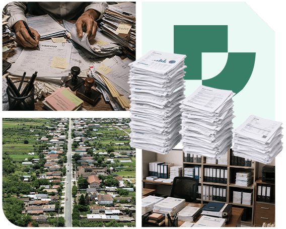 Archivo predial en papel apilado sobre un escritorio, junto a la vista aérea de un municipio